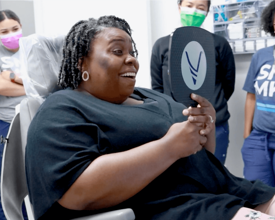 Shalara seeing her dental implants for the first time