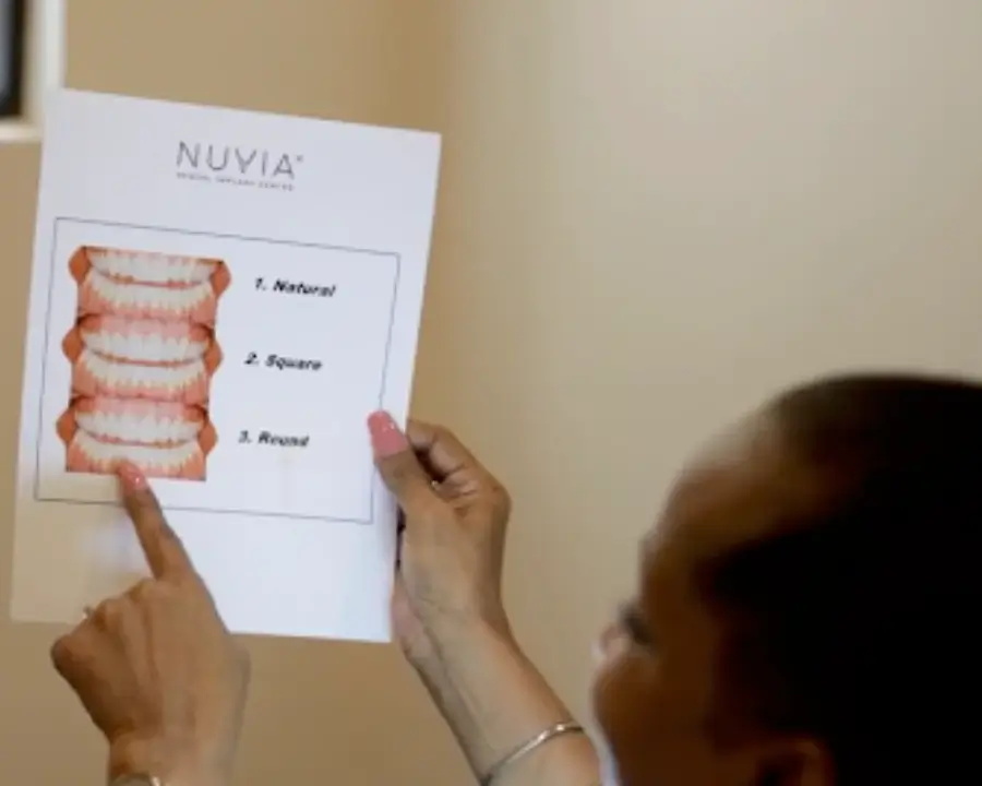 Woman looking at implant design options