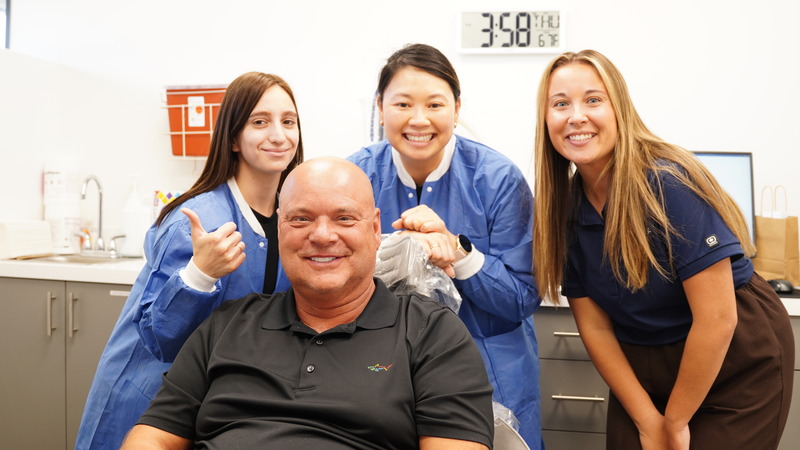 Nuvia team having just finished this man's oral surgery and placing his permanent teeth