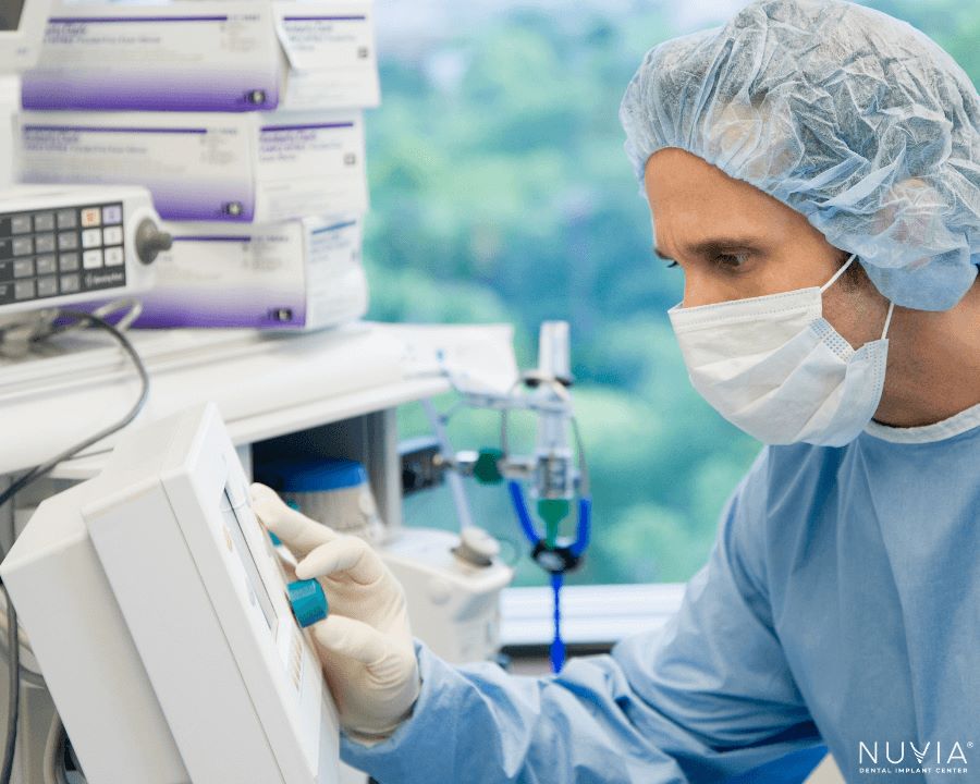 CRNA closely monitoring patient to provide a protected airway