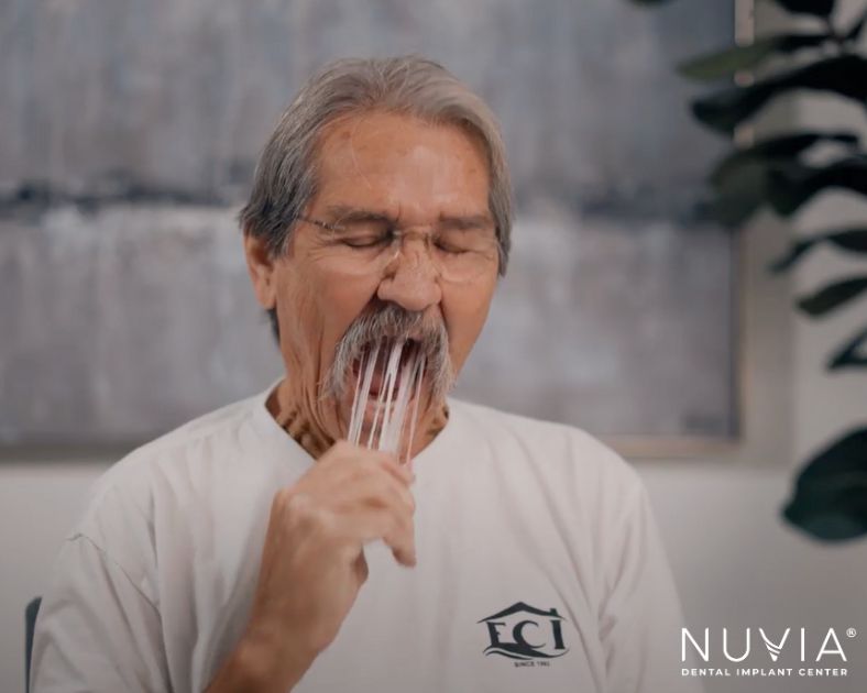 Man removing unpleasant acrylic dentures