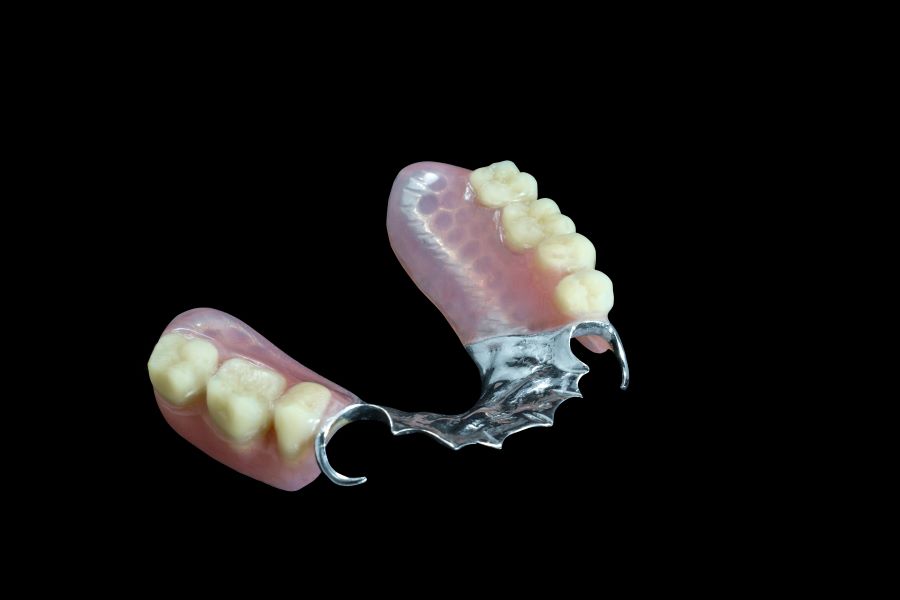 partial dentures against a black background