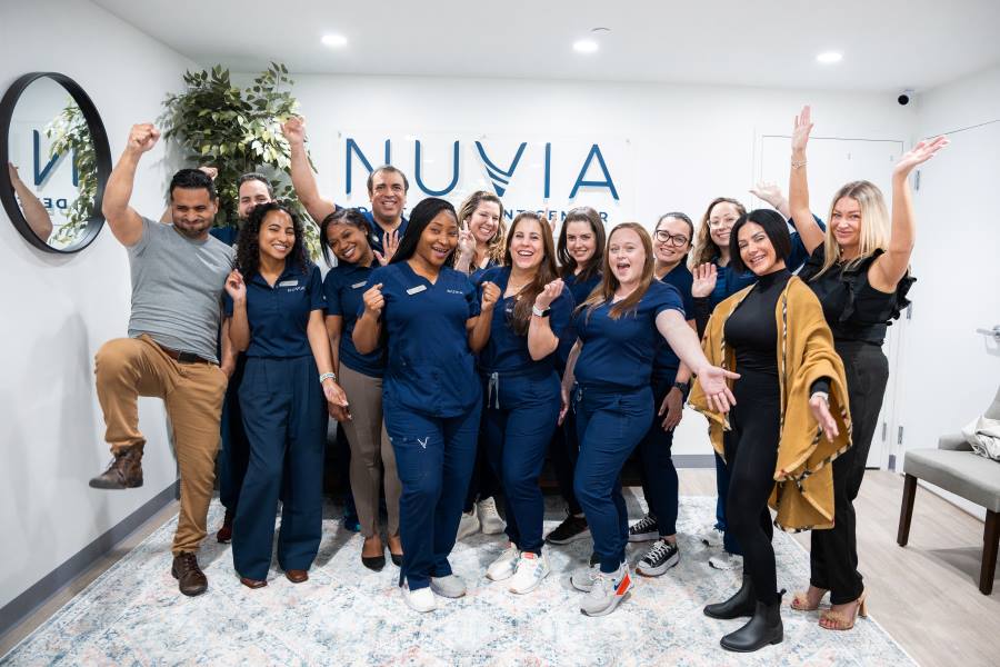 Dental implants in Miami team celebrating at their opening day