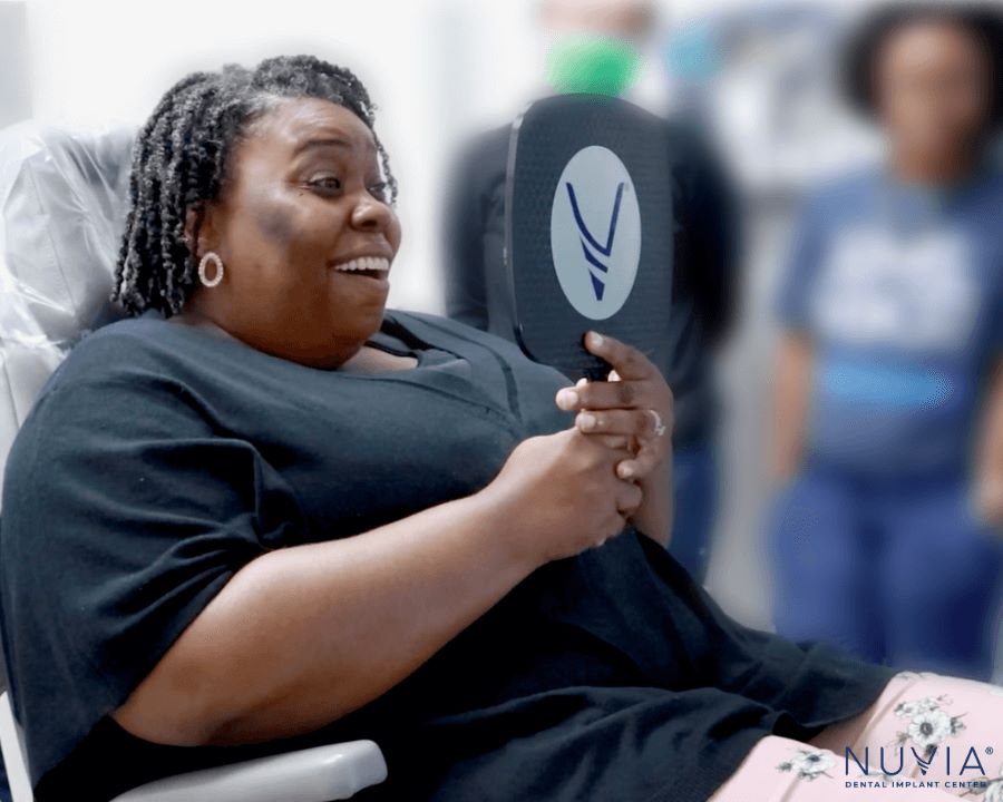 Patient smiling after successful procedure despite diabetes and dental implant
