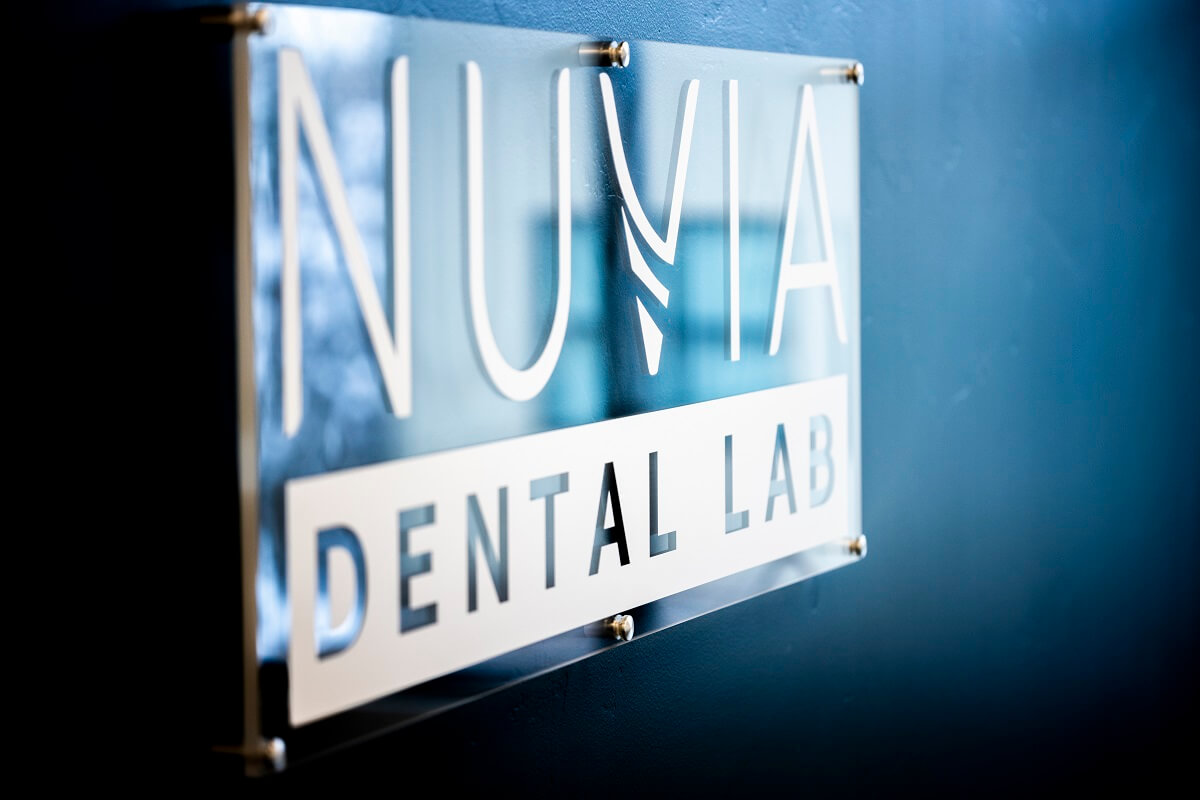 Nuvia Dental Implant Center Sign