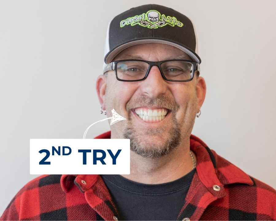 Man with new dental implants smilng