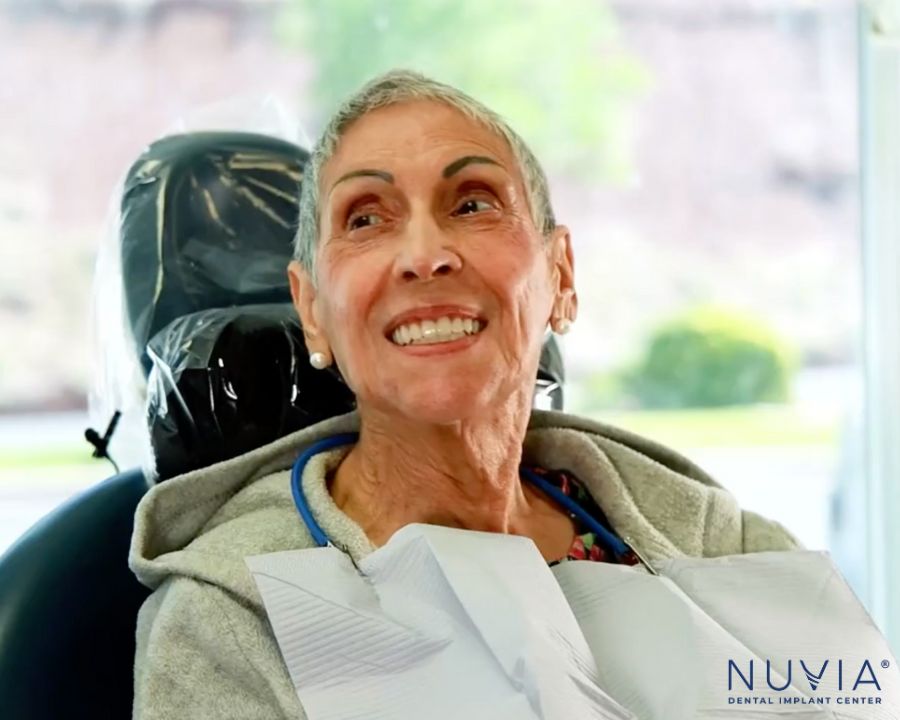 Smiling Nuvia patient enjoying life with dental implants