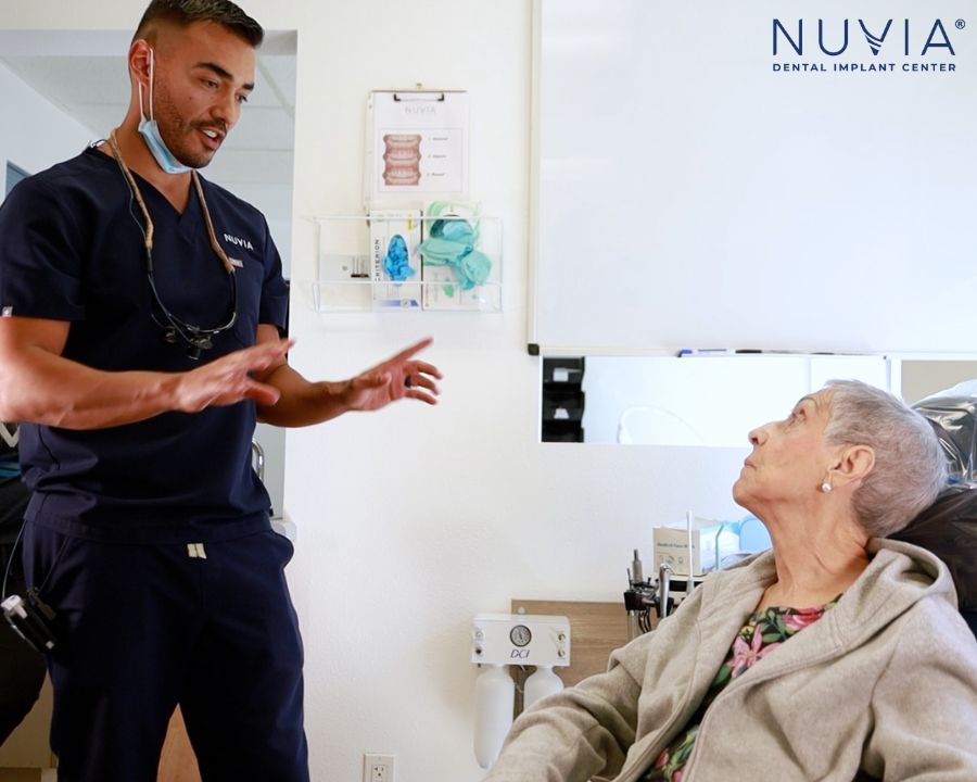 Dentist talking with patient