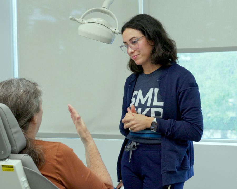 Restorative dentist speaking to patient