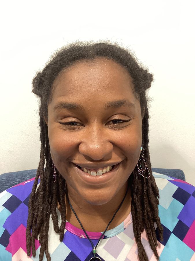 Angel smiling before getting her new teeth