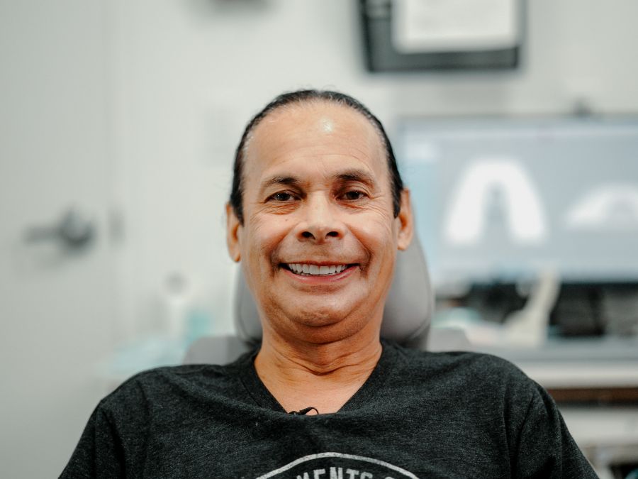 Pedro smiling after dental implants at Nuvia fixed the issues that came from dental tourism
